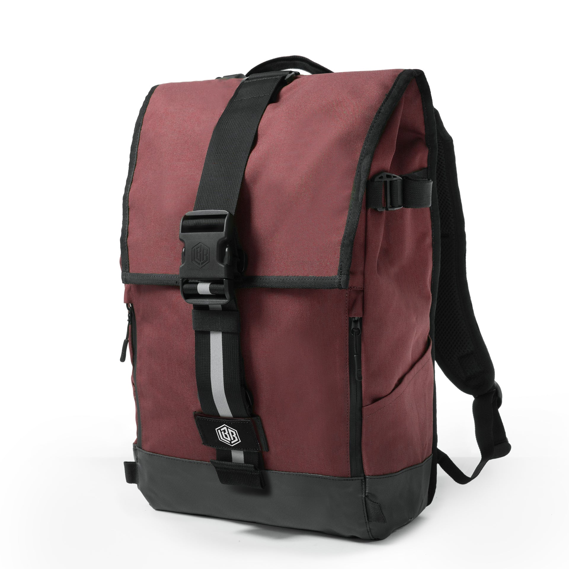 The Breakaway flap backpack in burgundy with a buckle closure and reflective strap, three-quarter view on white.